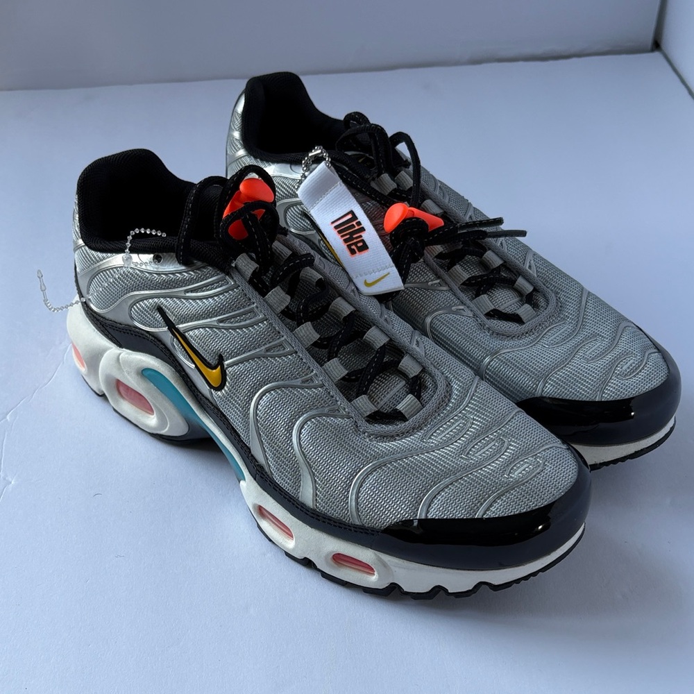 Nike Women’s Gray and Black Sneakers with Orange Accents